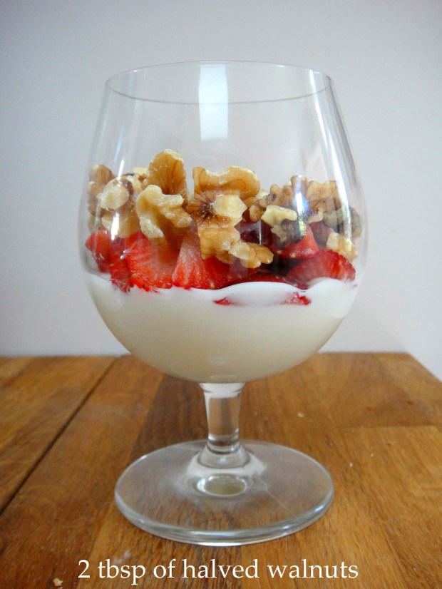Yogurt, strawberries and walnuts Yogurt, strawberries and walnuts in a glass